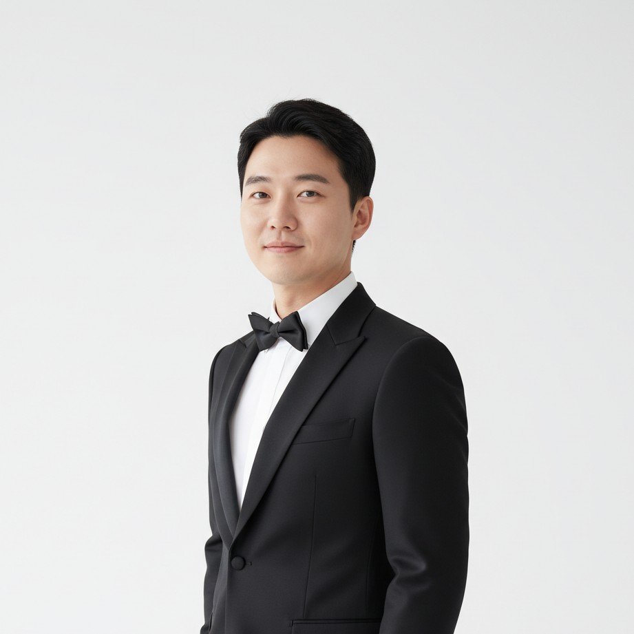 Korean minimalist studio wedding portrait of the groom, with soft lighting and a clean background.